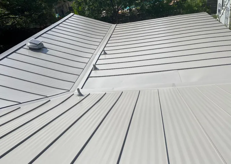 Solar attic fan installed on a metal roof for Roof Ventilation in Stratmoor